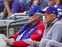 Texas Rangers co-chairman and managing partner Ray C. Davis (left) and chairman, ownership committee and chief operating officer Neil Leibman watch during the third inning of a spring training game against the Chicago Cubs at Surprise Stadium on Thursday, Feb. 27, 2020, in Surprise, Ariz.
