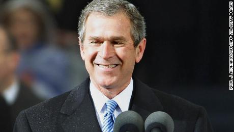 WASHINGTON, DC - JANUARY 20:  US President George W. Bush stands at the podium before giving his inaugural address after taking his oath of office 20 January 2001 at the US Capitol in Washington, DC. Bush is the 43rd US president.  (Photo credit should read PAUL RICHARDS/AFP via Getty Images)