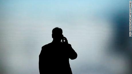 A man talks on his phone at the Mobile World Congress (MWC) in Barcelona on February 27, 2019. - Phone makers will focus on foldable screens and the introduction of blazing fast 5G wireless networks at the world&#39;s biggest mobile fair as they try to reverse a decline in sales of smartphones. (Photo credit should read PAU BARRENA/AFP via Getty Images)