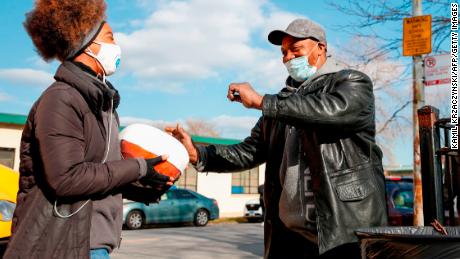 Volunteers distribute free turkeys to those in need on behalf of Chance The Rapper charitable foundation SocialWorks ahead of the Thanksgiving holiday in Chicago, Illinois, on November 23, 2020.