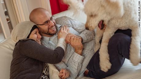 Layla Barakat, left, and her son, Farris Barakat and dog, AJ, hang out on the couch at the Barakat household in Raleigh, North Carolina on Wednesday, December, 20, 2017. Three years ago, Layla&#39;s son, Deah Barakat was murdered in his home along with his wife and wife&#39;s sister.
Mike Belleme for CNN