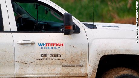 A pick up truck from Montana-based Whitefish Energy Holdings is seen parked on a working site in Manati, Puerto Rico October 31, 2017.
Whitefish Energy had won a $300-million contract to help turn the lights back on in Puerto Rico, where some 80 percent of customers still lack power more than a month after Hurricane Maria ripped through the island. But Puerto Rico is scrapping the deal with the tiny American firm that fell under intense scrutiny the head of its power authority said on October 29, 2017. / AFP PHOTO / Ricardo ARDUENGO        (Photo credit should read RICARDO ARDUENGO/AFP via Getty Images)