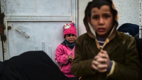 A refugee girl reacts near the Turkish border crossing gate as Syrians fleeing the northern embattled city of Aleppo wait on February 6, 2016 in Bab al-Salama, near the city of Azaz, northern Syria.
Thousands of Syrians were braving cold and rain at the Turkish border Saturday after fleeing a Russian-backed regime offensive on Aleppo that threatens a fresh humanitarian disaster in the country&#39;s second city. Around 40,000 civilians have fled their homes over the regime offensive, according to the Syrian Observatory for Human Rights monitor. / AFP / BULENT KILIC        (Photo credit should read BULENT KILIC/AFP/Getty Images)