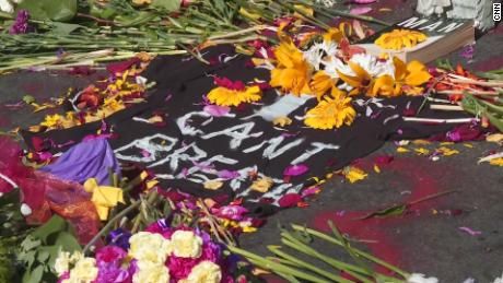 A memorial of flowers and candles grows around the words &quot;I can&#39;t breathe&quot; outside Cup Foods in Minneapolis, Minn. on May 30, 2020 in response to the death of George Floyd.