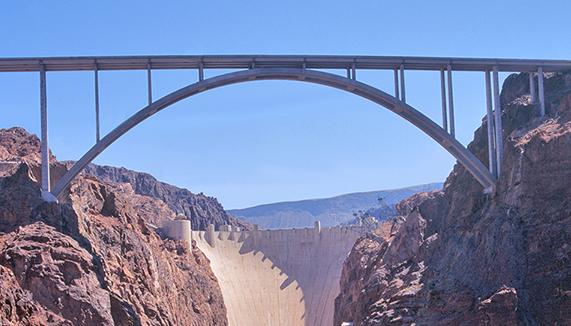 Bridge spanning over a dam