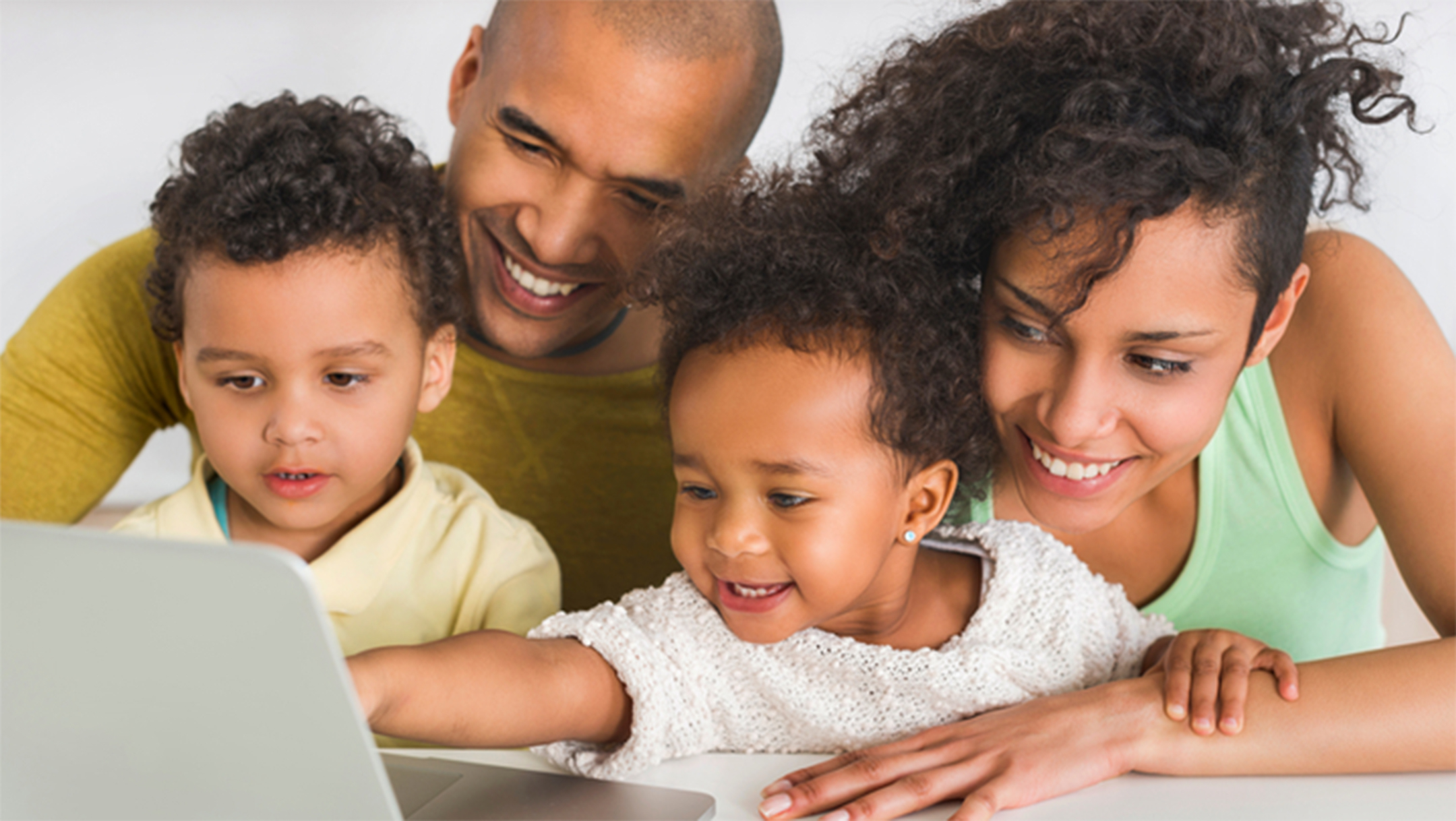 Family looking at computer screen