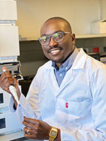 Photo courtesy of Dr. Admire Dube. Dr. Admire Dube working in a lab.