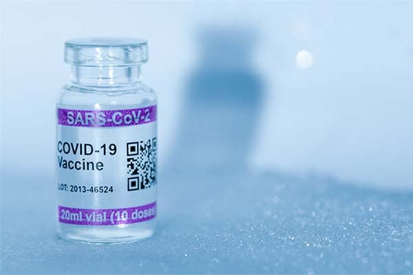 COVID-19 vaccine vial in a cold environment