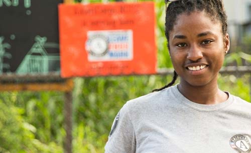 AmeriCorps NCCC member in urban garden project