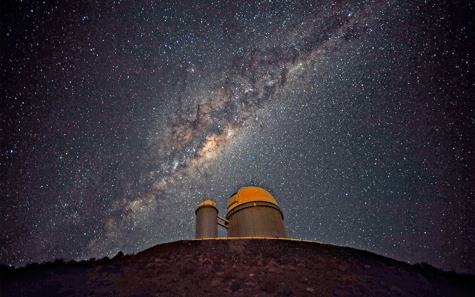 slide 2 - Photo of the Milky Way galaxy above La Silla observatory