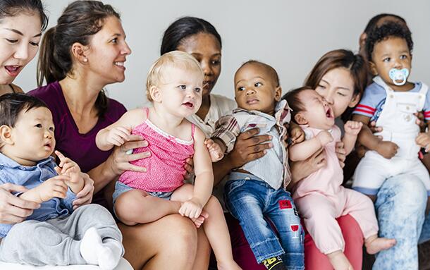 stock image of mothers with their babies