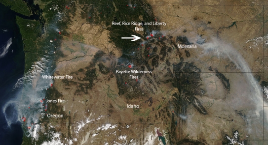 A natural-color image captured by the Moderate Resolution Imaging Spectroradiometer (MODIS) aboard NASA’s Terra satellite on August 27, 2017, shows dozens of wildfires burning in the western United States.