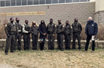 Group photo of Director and nine law enforcement staff at Minnesota Valley National Wildlife Refuge