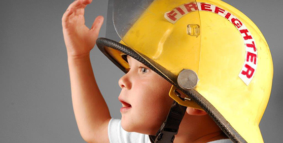 Profile of Child with fireman's hat