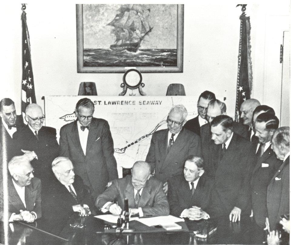 Dwight D. Eisenhower signing a document