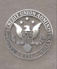 The NCUA official seal on a stone background