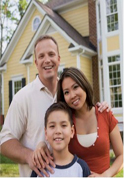 Family in front of house