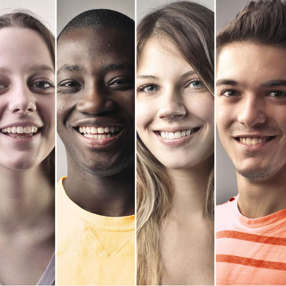 The smiling, diverse faces of six young students