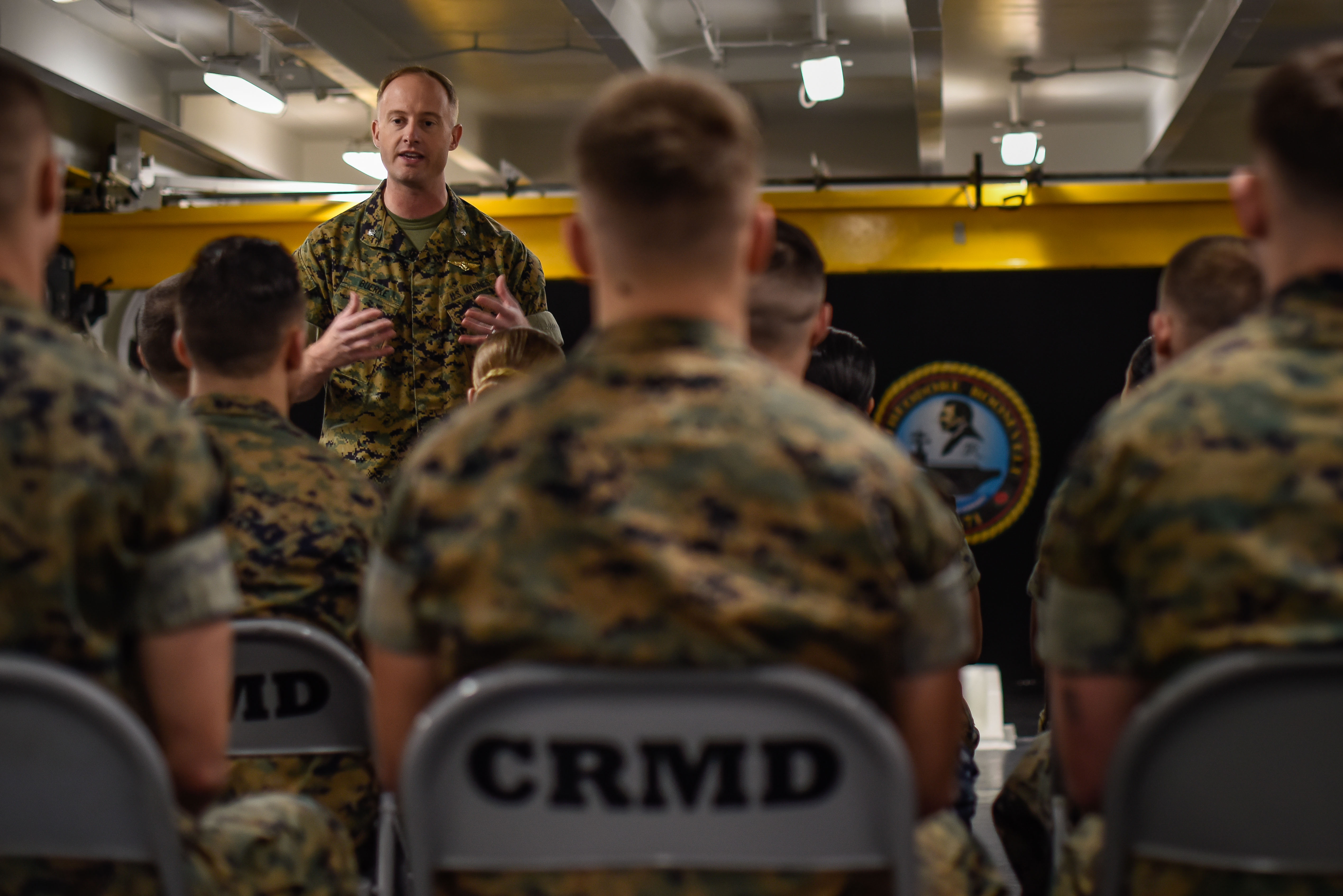 Lieutenant lecturing sailors in session