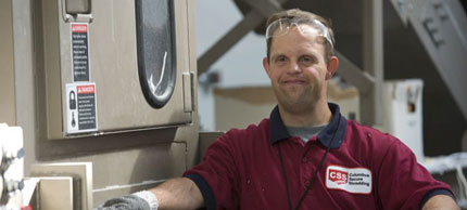 Photo of man operating shredder.