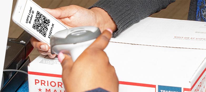 Customer presenting a USPS Label Broker QR code to print a label and ship a package at the Post Office counter.