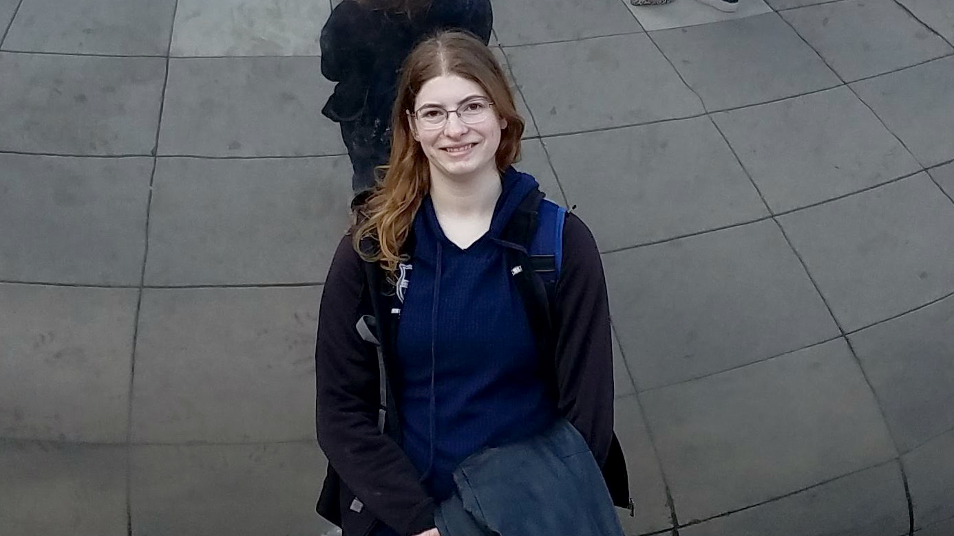 Susanna Eschbach poses in front of a mirrored background.