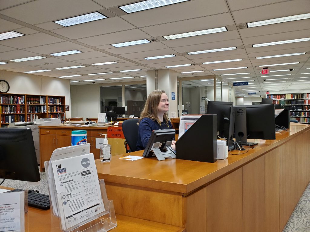Anna Price, legal reference librarian, at the Law Library of Congress Reading Room reference desk. Photo by Barbara Bavis. [Note: the photo is for illustrative purposes only; no staff are currently working in the Reading Room.]