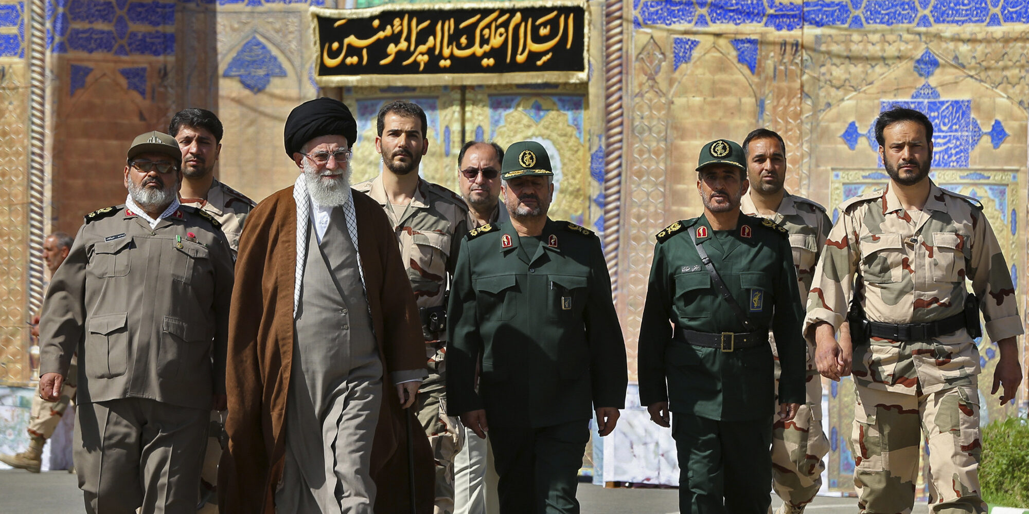 In this picture released by an official website of the office of the Iranian supreme leader on Wednesday, May 20, 2015, Supreme Leader Ayatollah Ali Khamenei, second left, attends a graduation ceremony of Revolutionary Guard officers in Tehran, Iran, as he is accompanied by Chief of the General Staff of Iran's Armed Forces, Hasan Firouzabadi, left, and Revolutionary Guard commander Mohammad Ali Jafar, center. Iran's supreme leader vowed Wednesday he will not allow international inspection of Iran's military sites or access to Iranian scientists under any nuclear agreement with world powers. (Office of the Iranian Supreme Leader via AP)