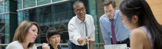 A photo of a workplace group meeting.