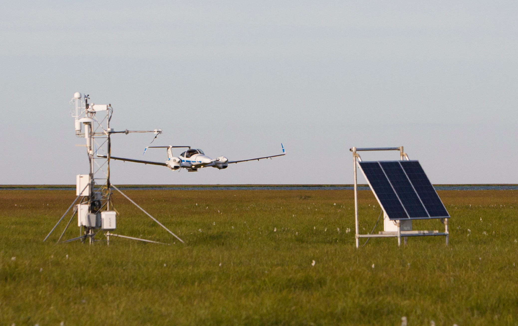 DA-42 performing low-level measurements near the ground-based flux tower 