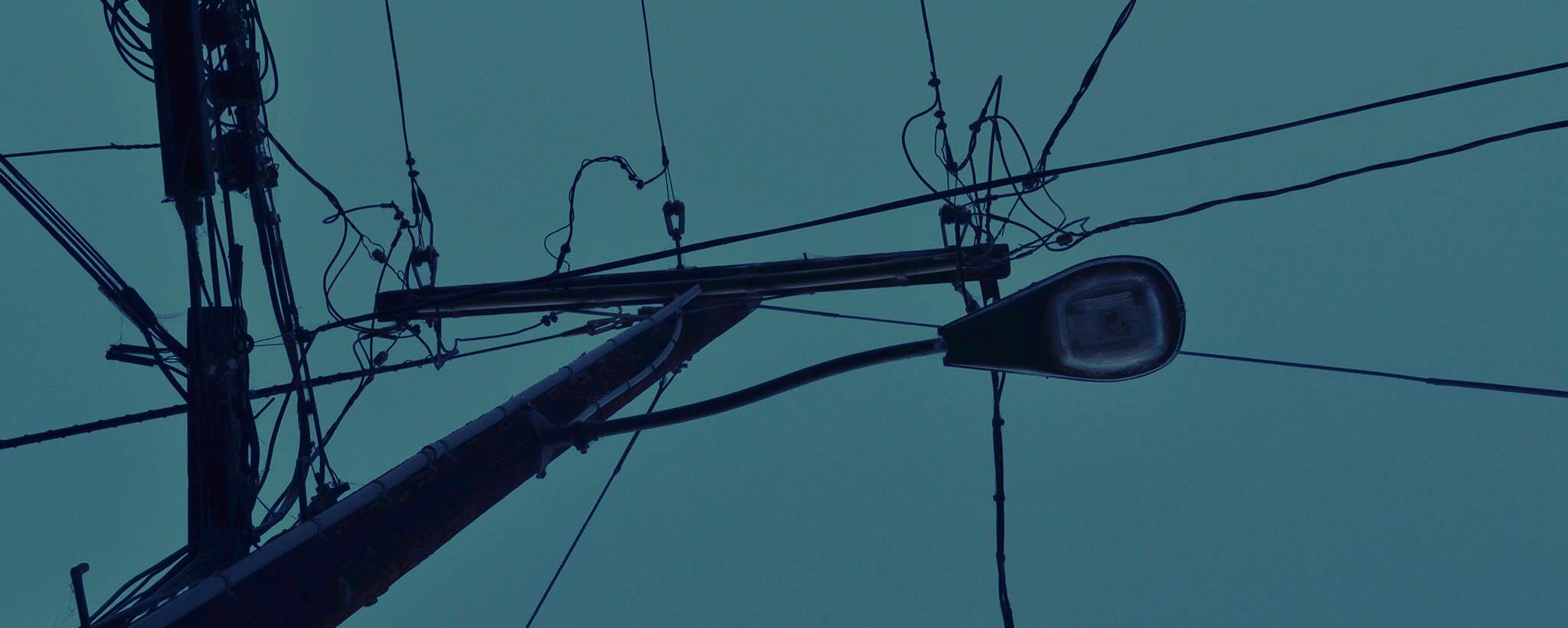 Unlit street light at night