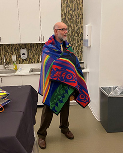 Fred Clark in gifted blanket.