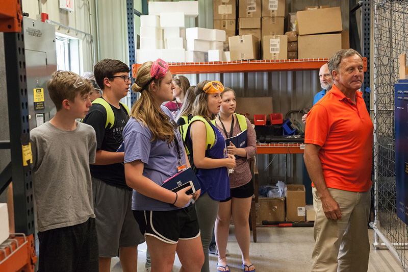 Randy briefs students on how the wind tunnel functions