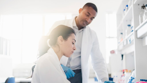 Two scientists at lab bench