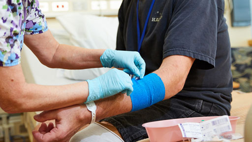 nurse treating patient