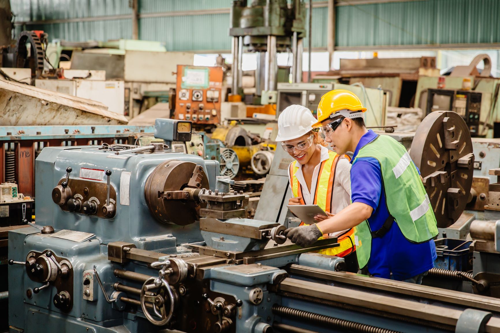 Photo of factory workers making rail crossing equipment