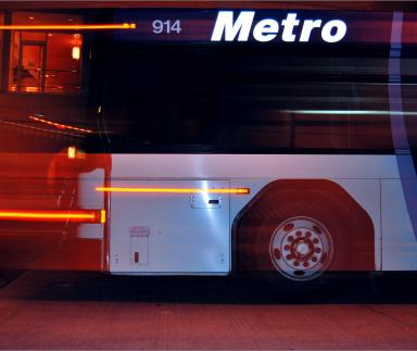 A metro bus at night.