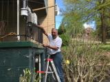 R. Subramanian repairing a RAMP at an Allegheny County Clean Air Now member's house near Neville Island.