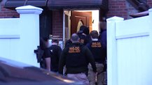 HHS OIG federal agents entering a home through the front door