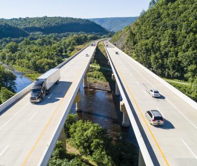 Cars on a freeway bridge.
