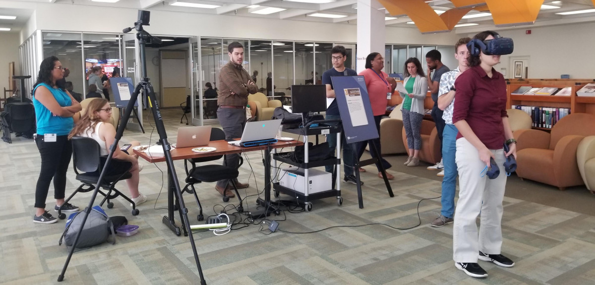 Members of Dr. Persky’s group demonstrate virtual reality technology in the NIH Library