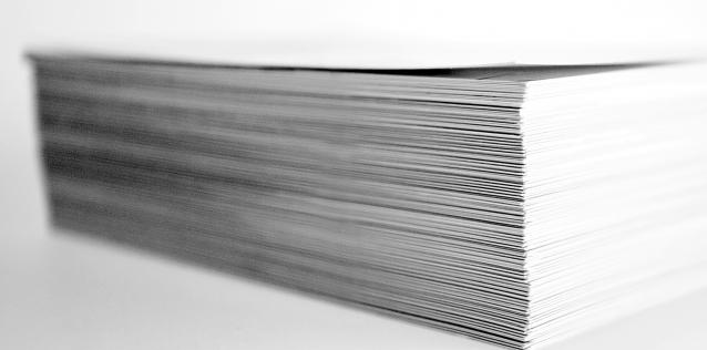 Stack of white paper on white backgrounnd