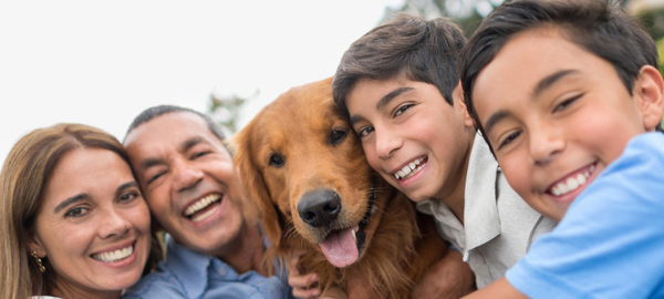 Family of four with dog