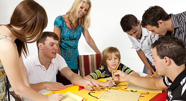 Youth collaborating with adults on a project