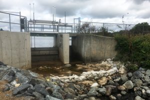 Scalley Dam Fishway gate in Woburn Massachussets surrounded by rocks