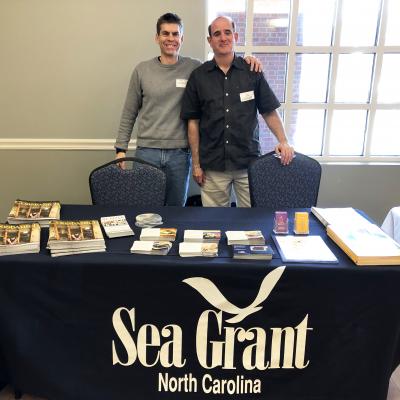 Barry Nash (right) stands next to another North Carolina Sea Grant staffer during an outreach event.