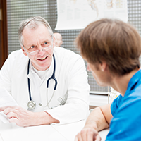 Male doctor reviewing information with patient