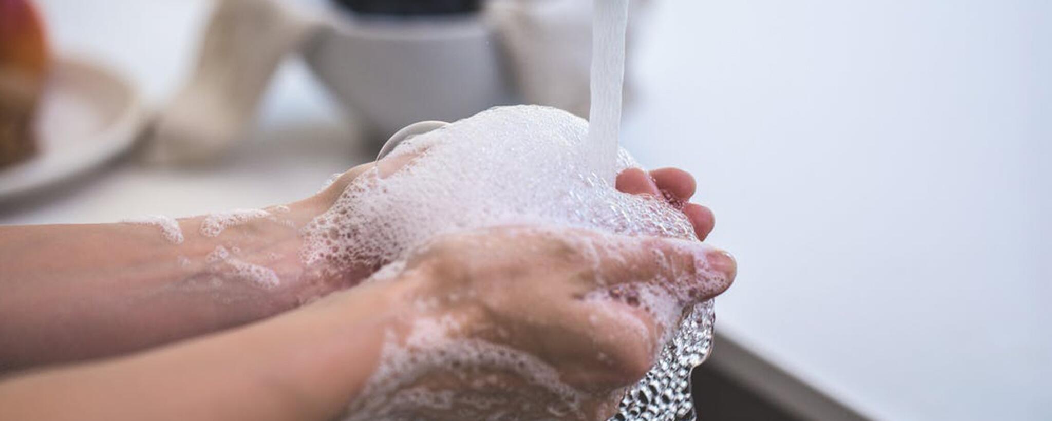 washing hands in the sink