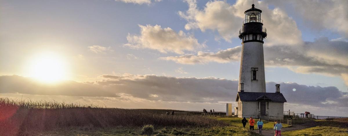 Children enjoy the last moments of sunshine at Yaquina Head Outstanding Natural Area