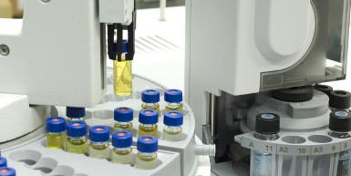 An image of a machine holding a liquid container in a lab